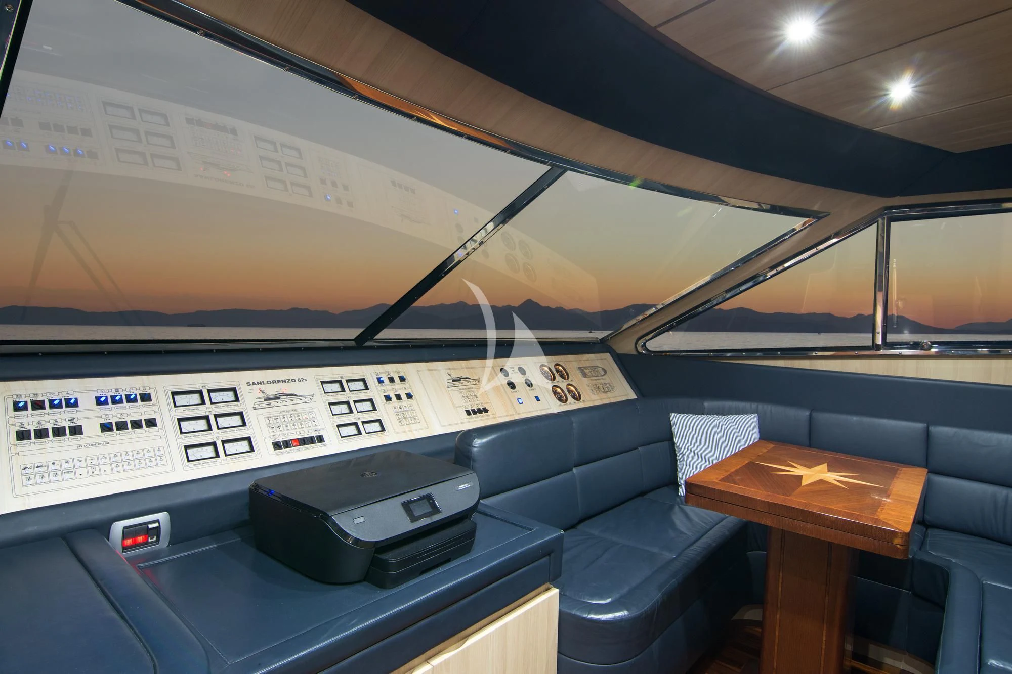 a computer on a desk aboard ACIONNA Yacht for Sale