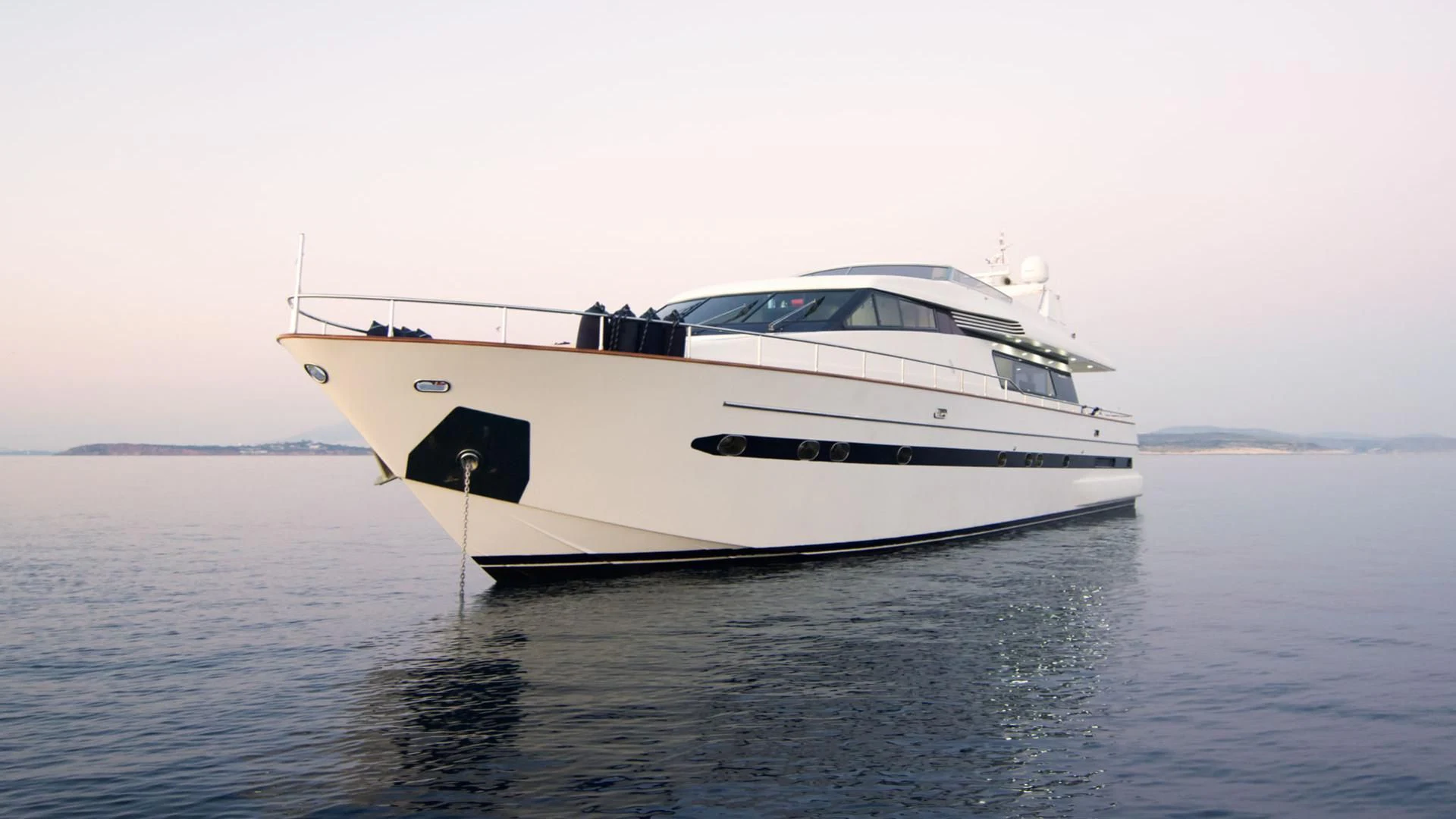 a white yacht in the water aboard ACIONNA Yacht for Sale