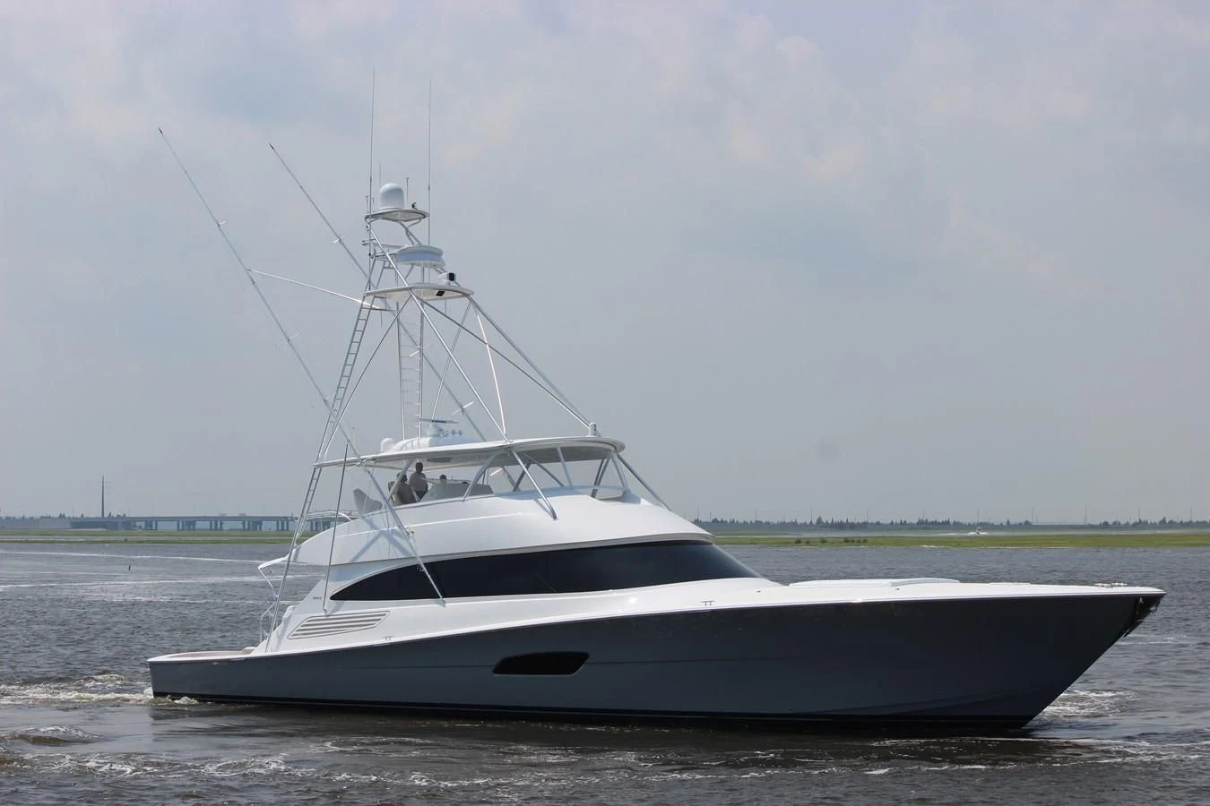 a white boat on the water aboard 2022 VIKING 92 CONVERTIBLE (TBD) Yacht for Sale