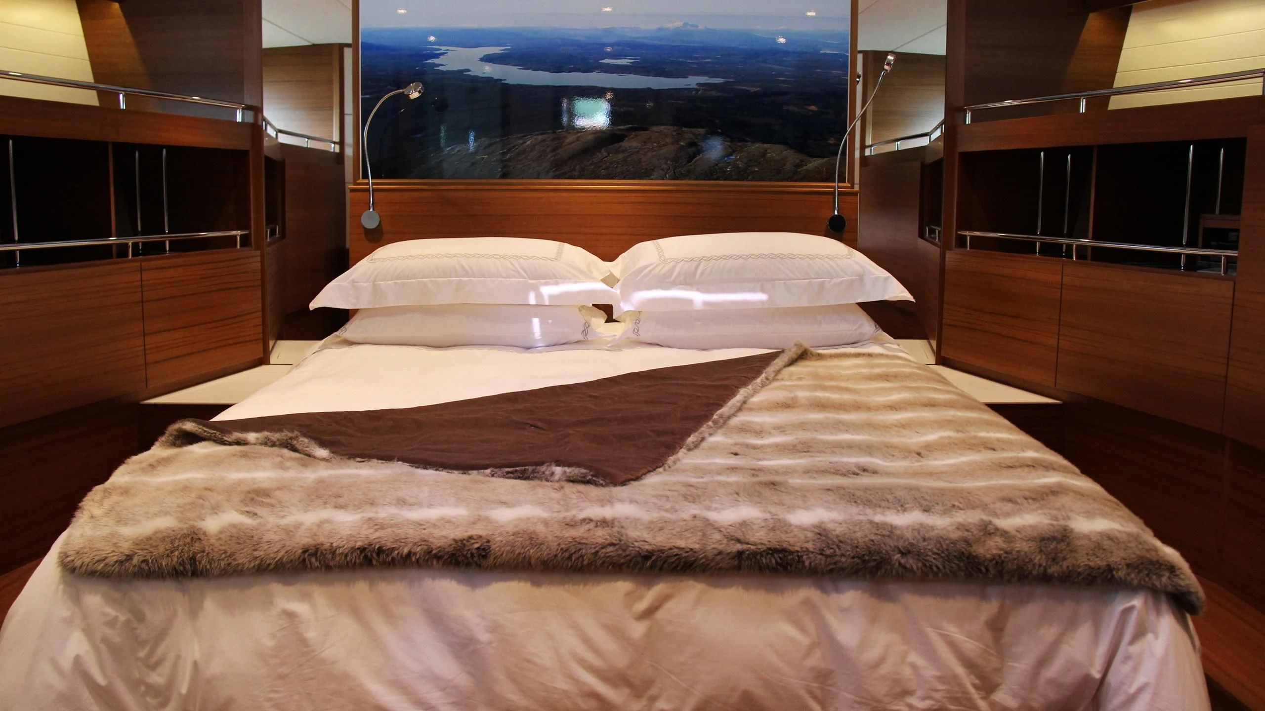 a bed with a large mirror aboard BIG BEAVER Yacht for Sale