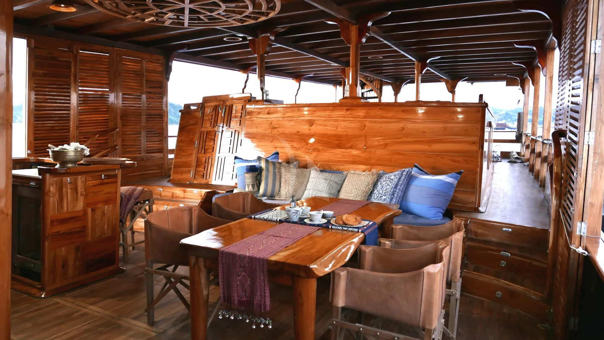 a cabin with a table and chairs aboard SEQUOIA Yacht for Sale