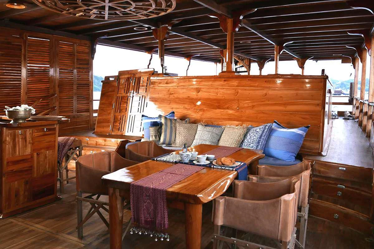 a cabin with a table and chairs aboard SEQUOIA Yacht for Sale