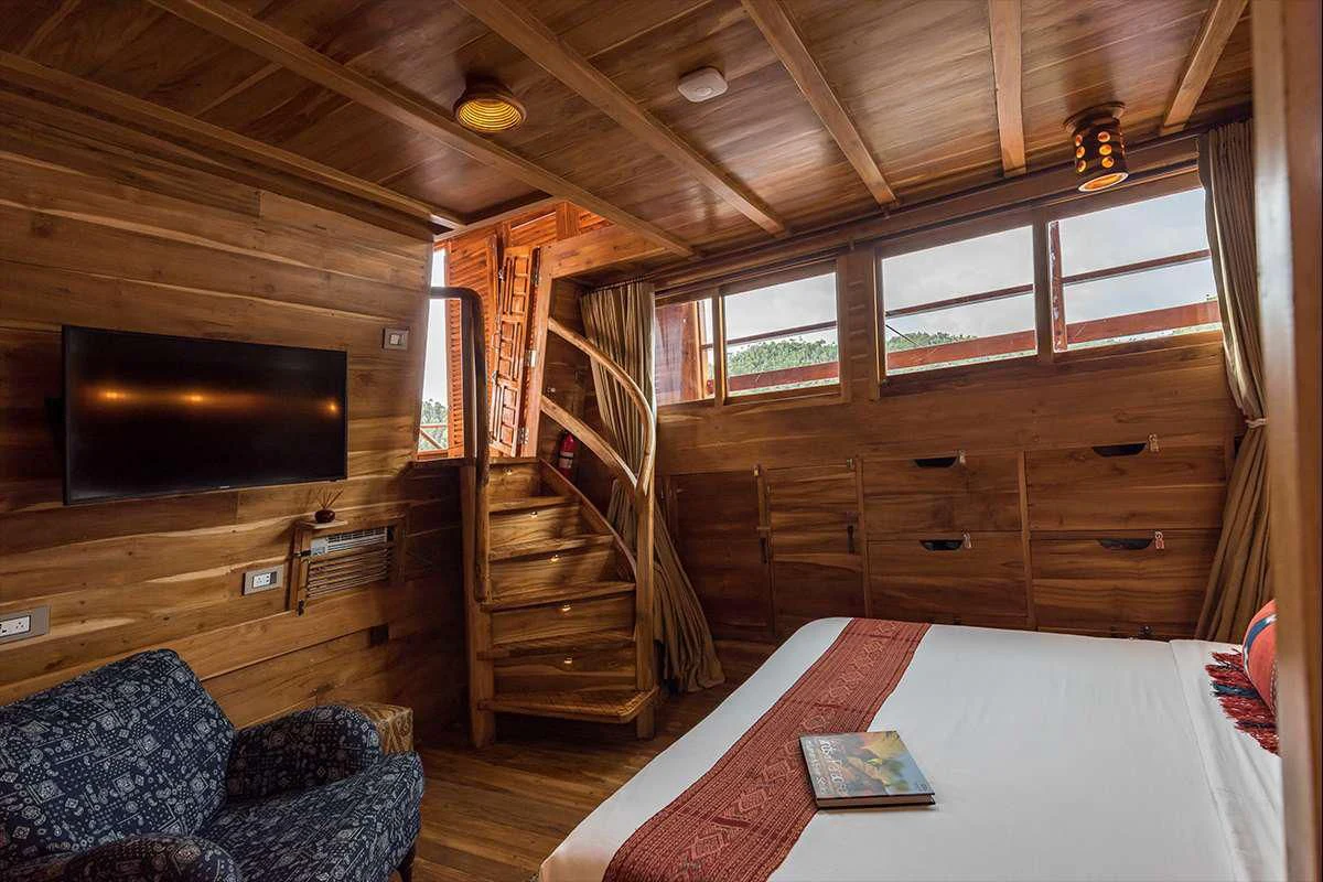 a room with a tv and a couch aboard SEQUOIA Yacht for Sale