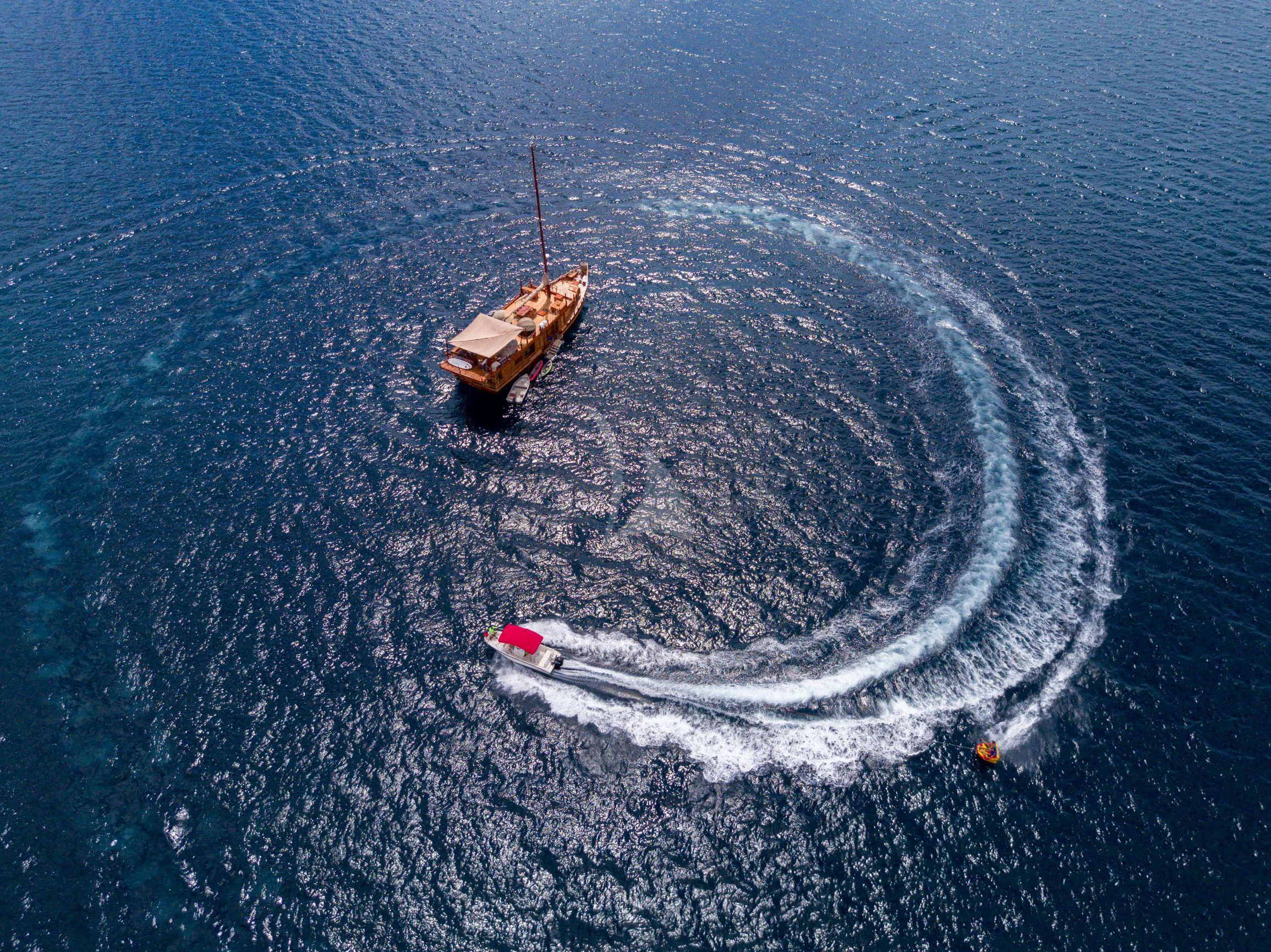 a small boat in the water aboard SEQUOIA Yacht for Sale