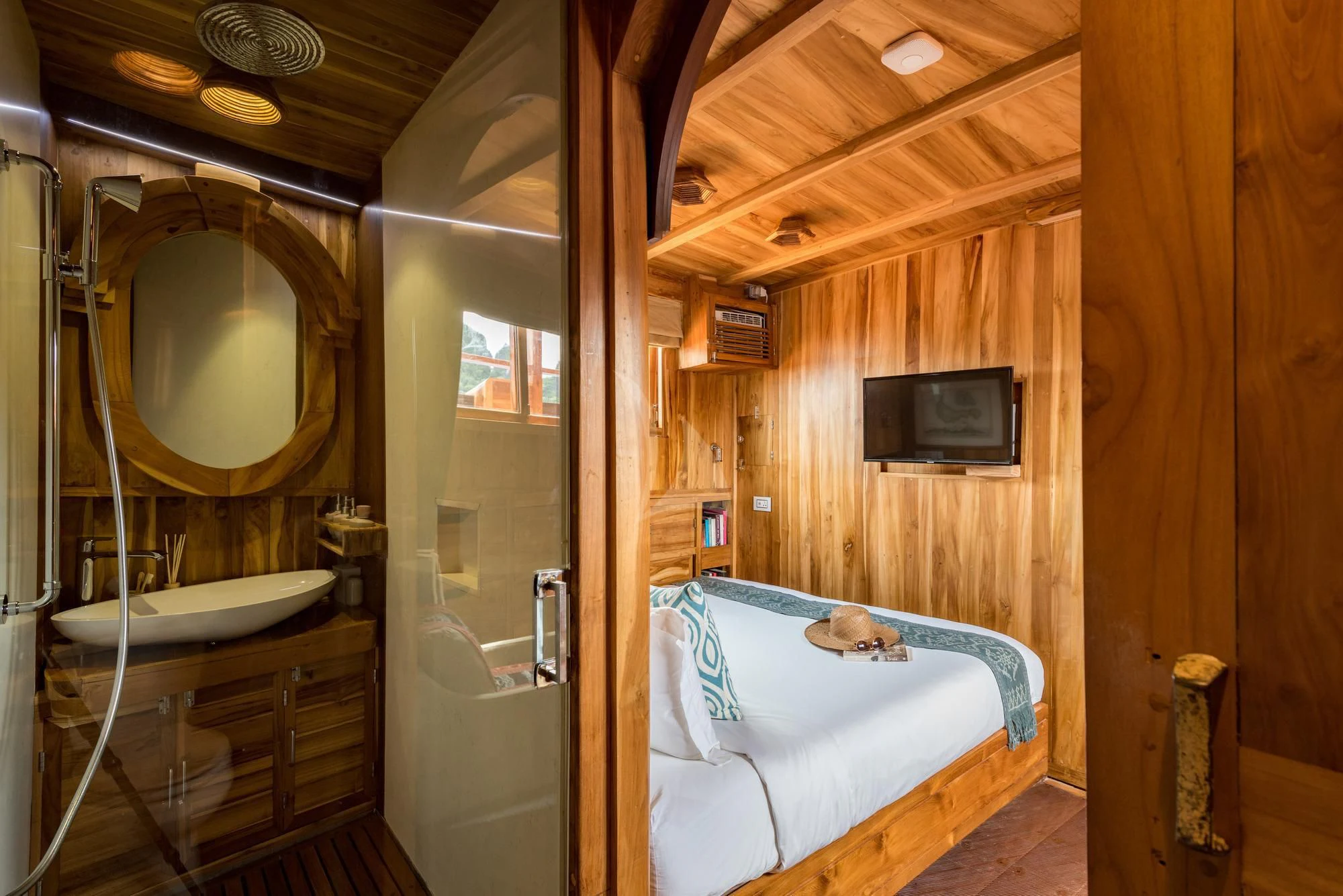 a bathroom with a bed and a television aboard SEQUOIA Yacht for Sale