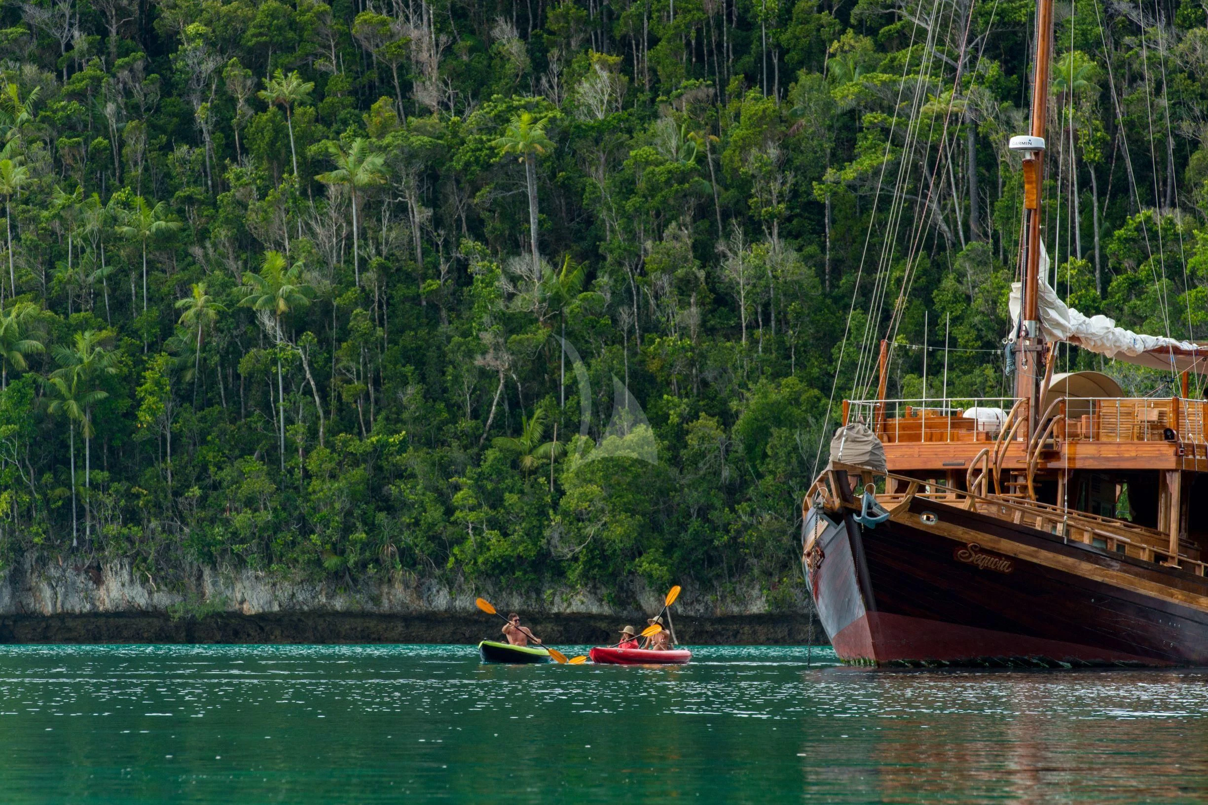 a group of people in boats in a lake aboard SEQUOIA Yacht for Sale