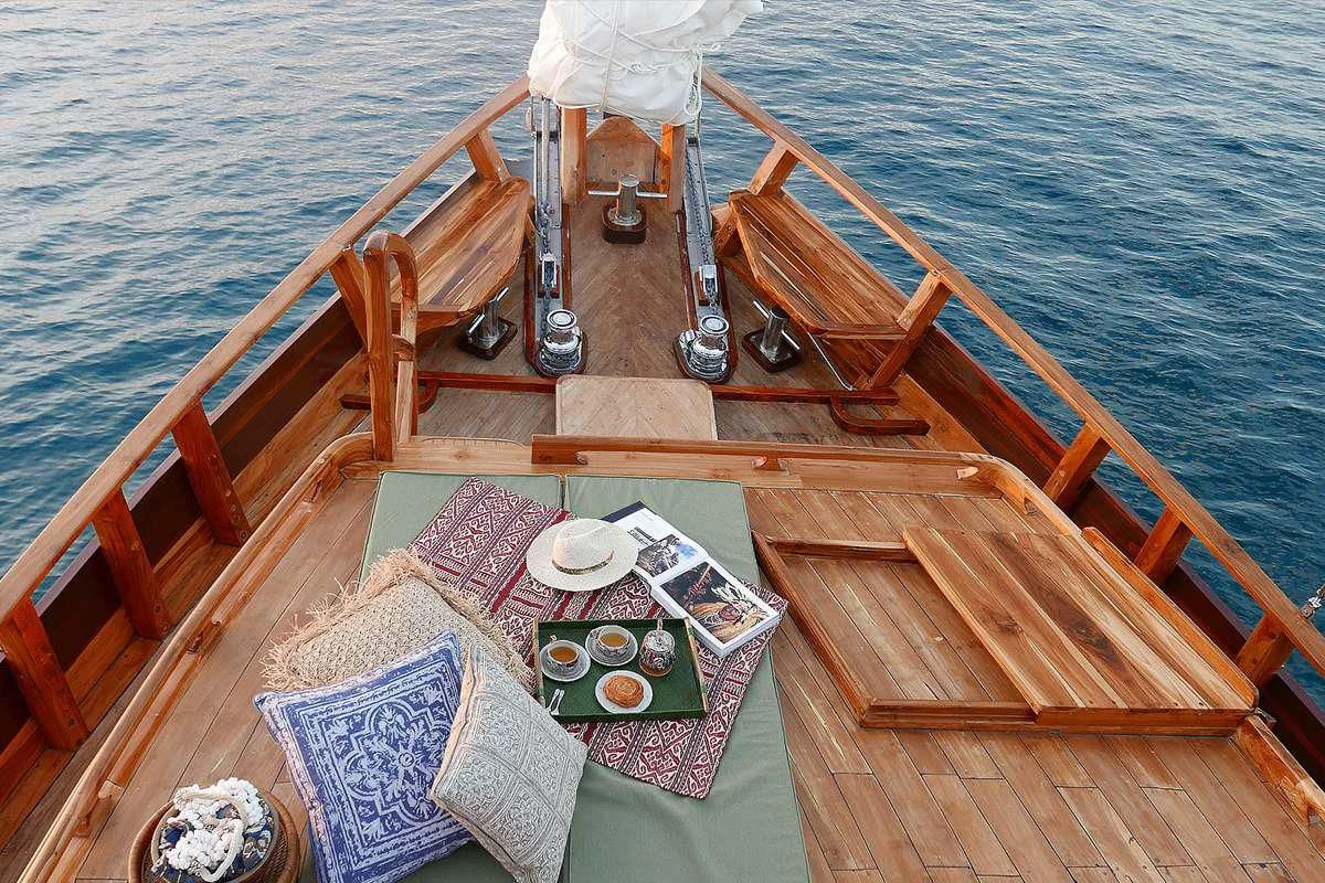 a wooden boat on the water aboard SEQUOIA Yacht for Sale