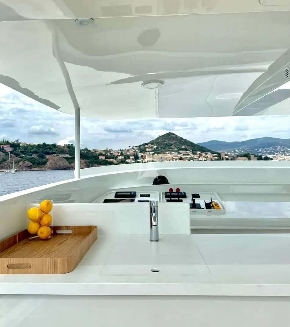 a white ceiling with a view of a city and water aboard ABELY Yacht for Sale