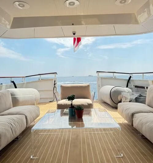 a room with a table and chairs aboard ABELY Yacht for Sale