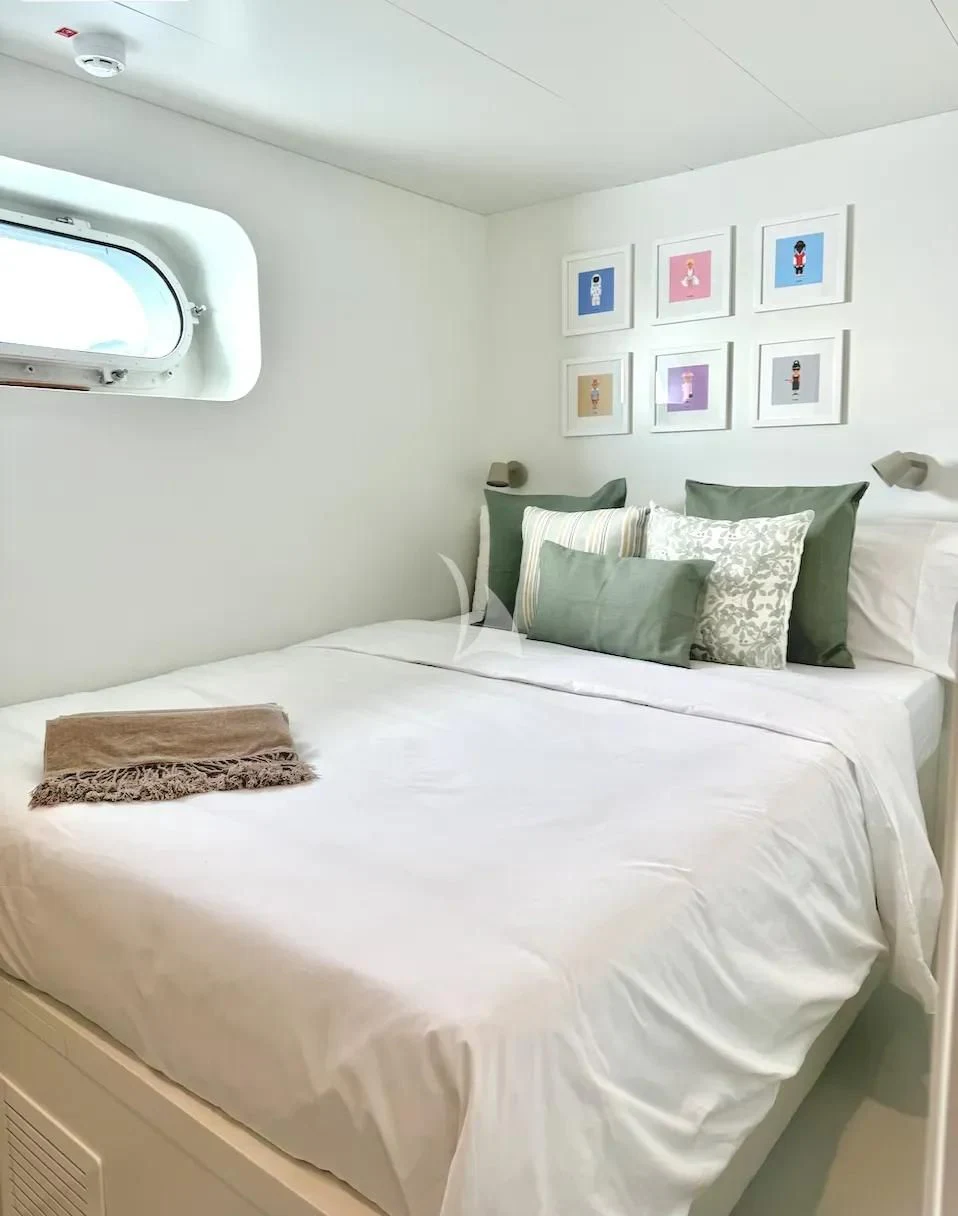 a bed with white sheets aboard ABELY Yacht for Sale