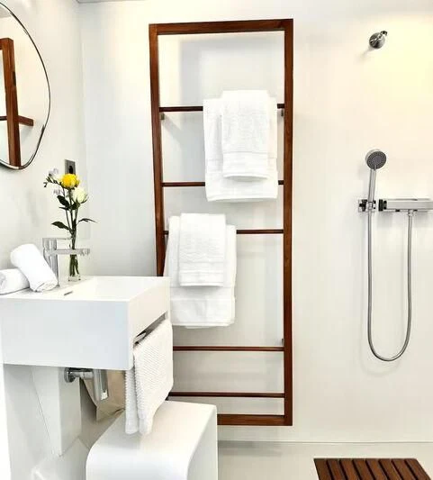 a bathroom with a sink and a shower unit aboard ABELY Yacht for Sale