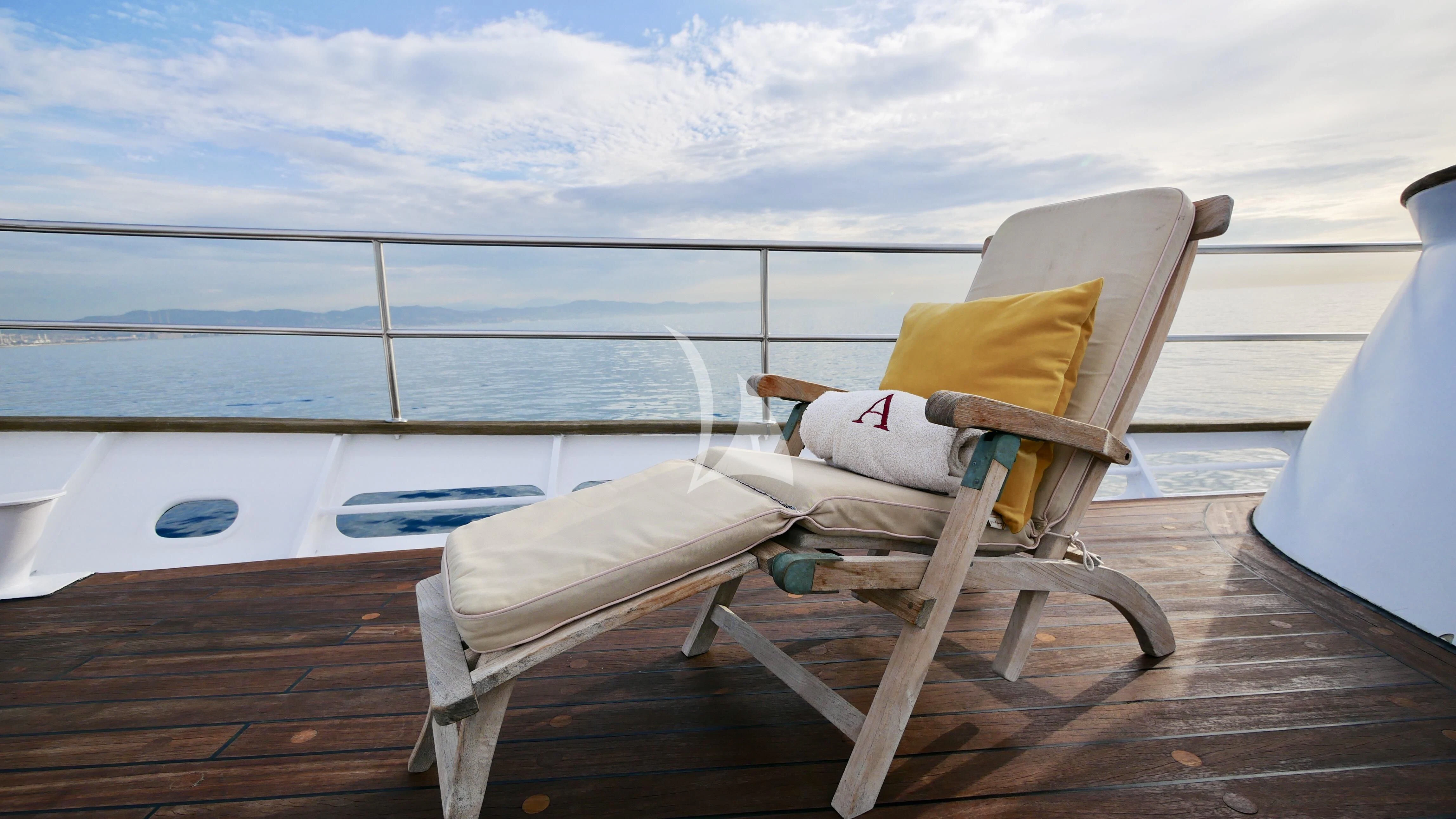 a bed on a deck aboard ABELY Yacht for Sale