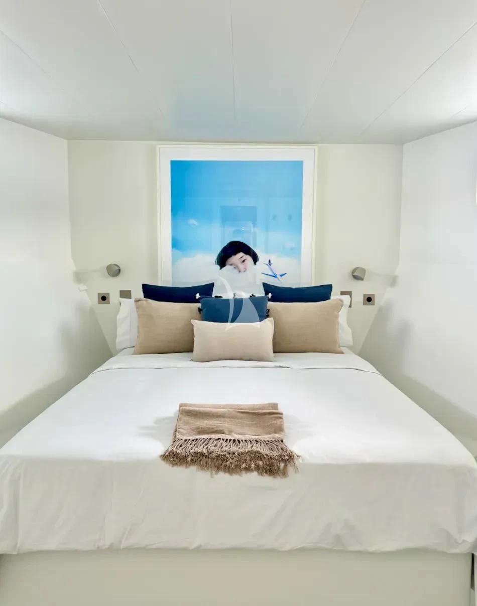 a person sitting on a bed aboard ABELY Yacht for Sale