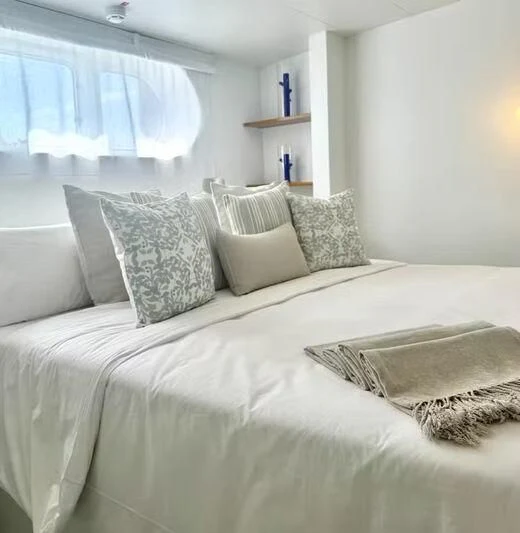 a bed with pillows aboard ABELY Yacht for Sale