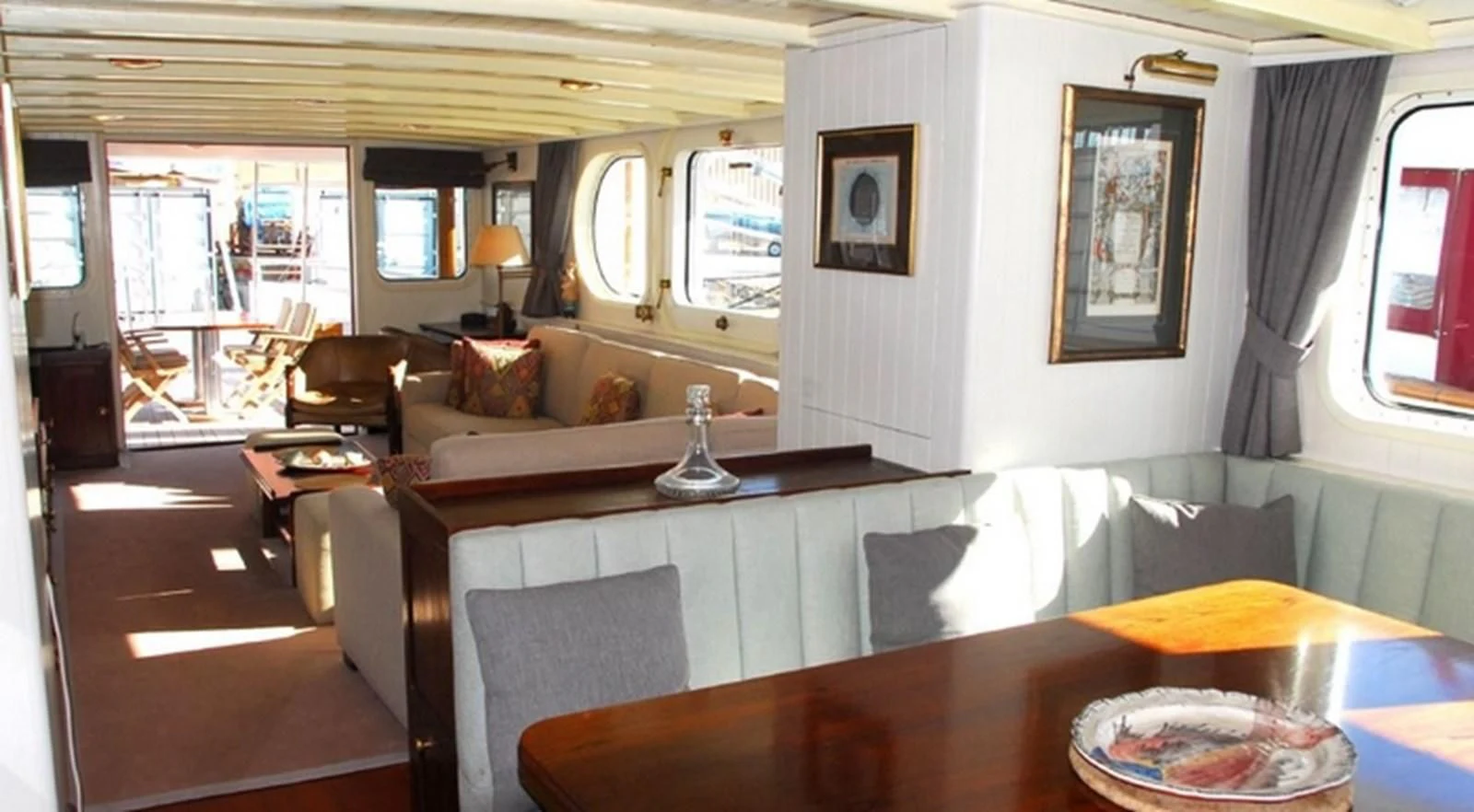 a living room with a large window aboard ABELY Yacht for Sale