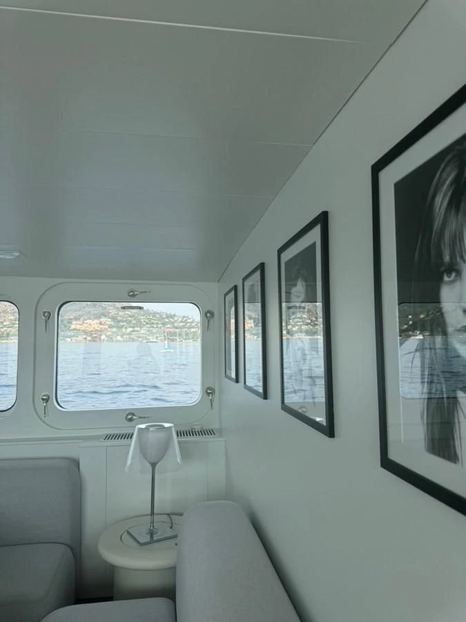 a room with a window and a lamp aboard ABELY Yacht for Sale