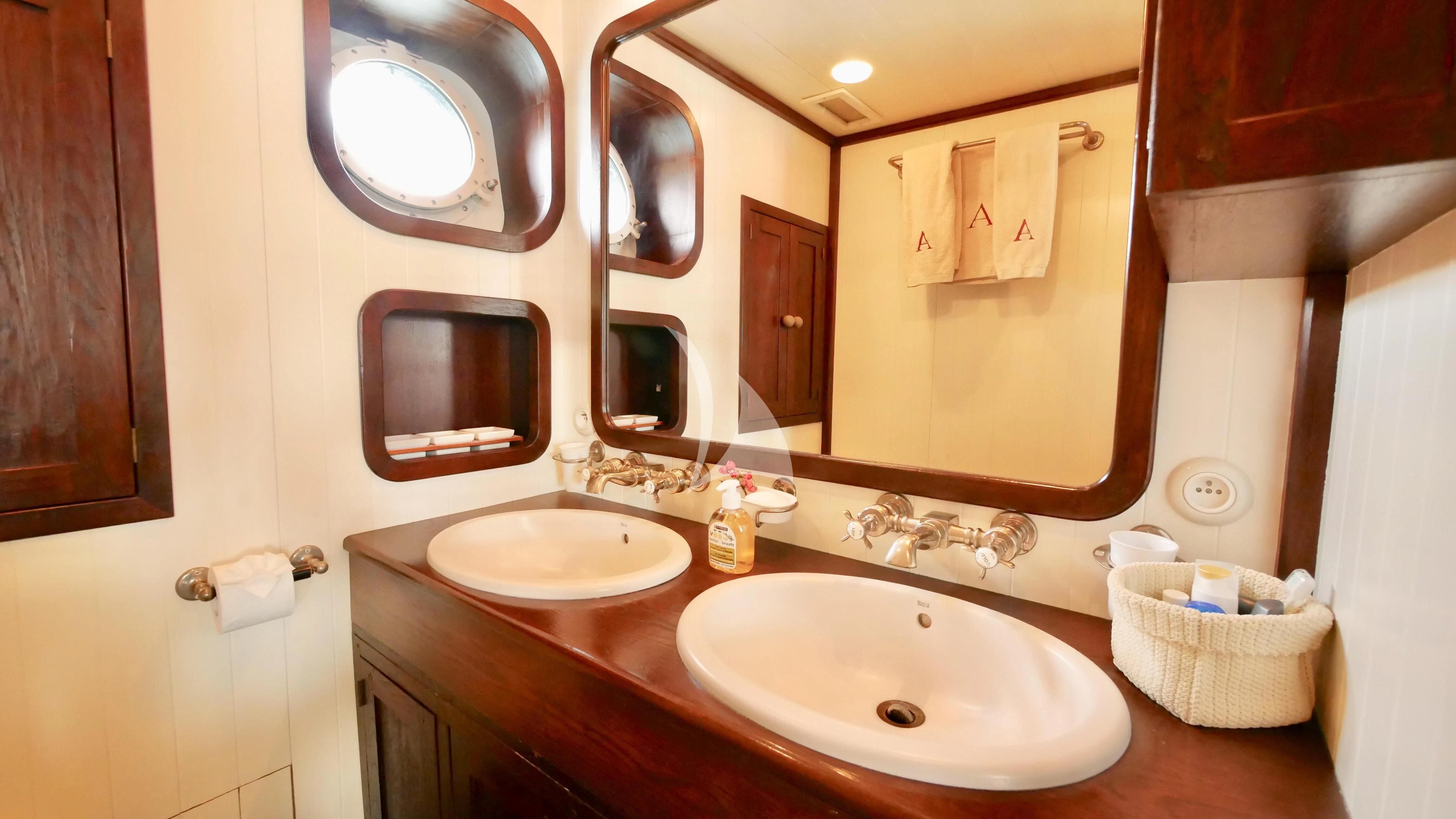a bathroom with two sinks aboard ABELY Yacht for Sale