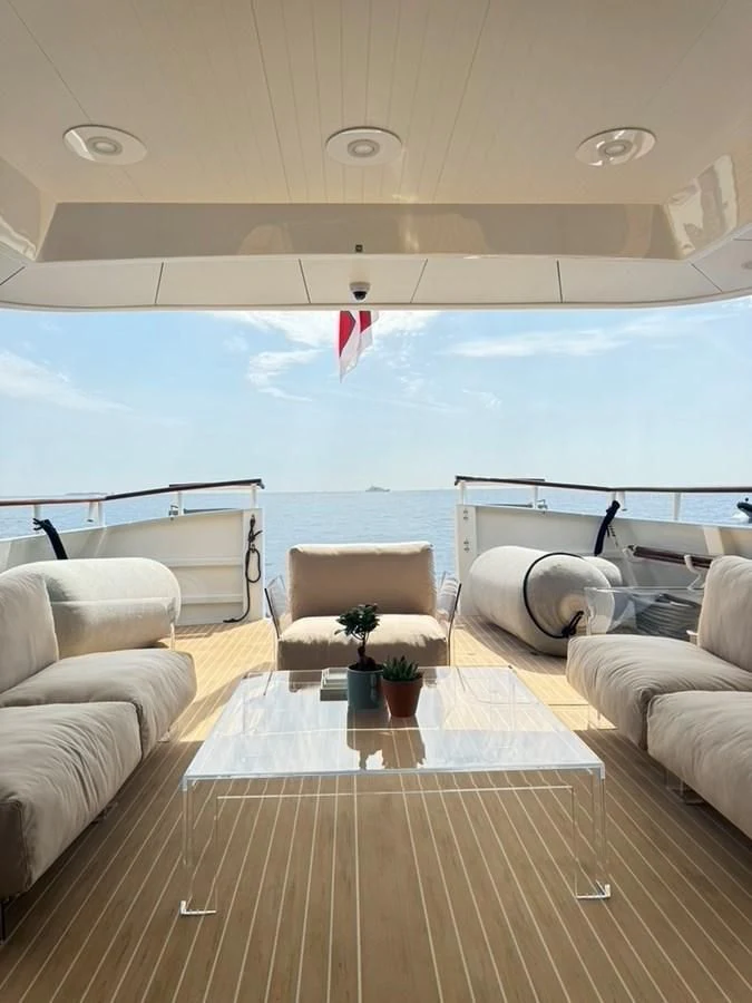 a room with a table and chairs aboard ABELY Yacht for Sale