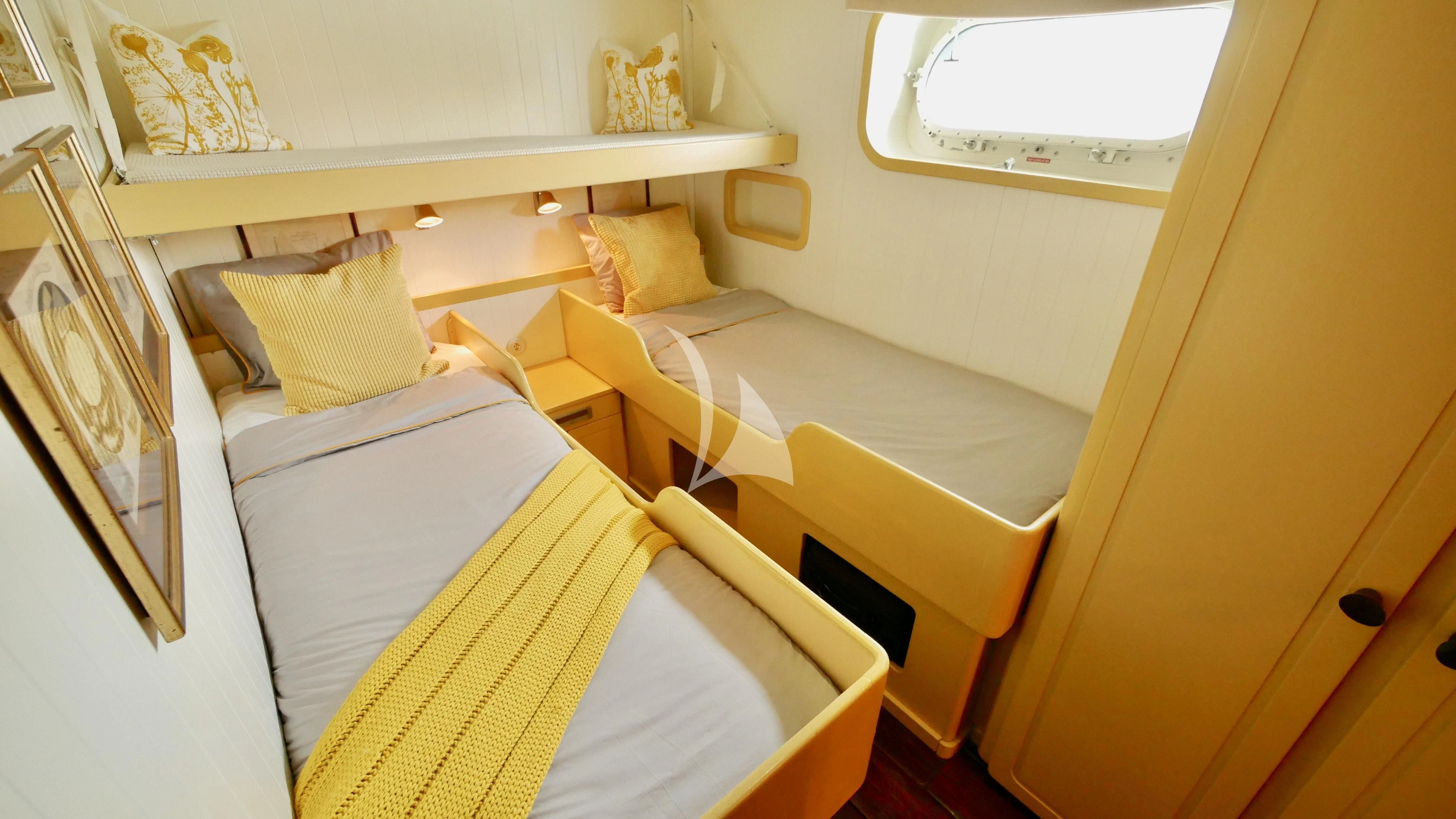 a room with beds and a window aboard ABELY Yacht for Sale