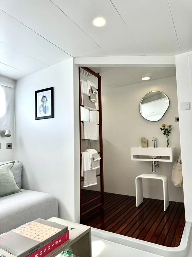 a bathroom with a mirror and a sink aboard ABELY Yacht for Sale
