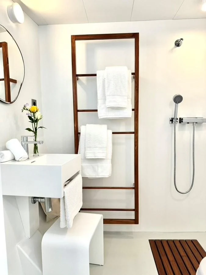 a bathroom with a sink and a shower unit aboard ABELY Yacht for Sale
