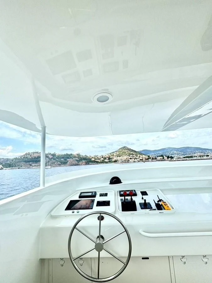 a white car on a boat aboard ABELY Yacht for Sale