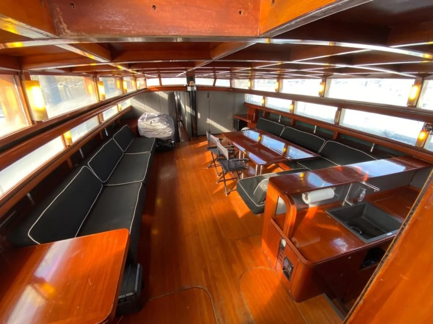 a room with a row of seats aboard LAUREN L Yacht for Sale