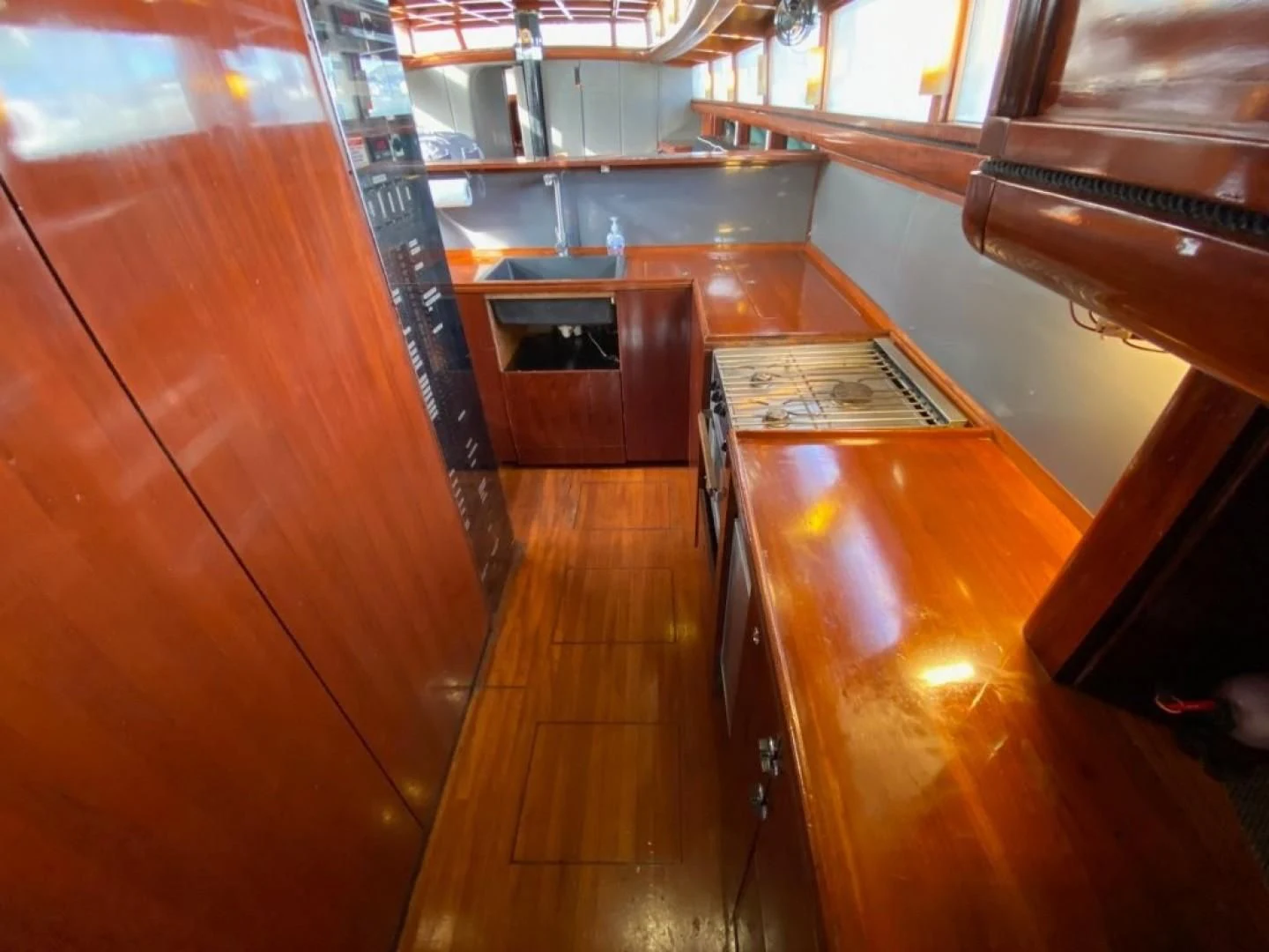 a kitchen with a wood floor aboard LAUREN L Yacht for Sale