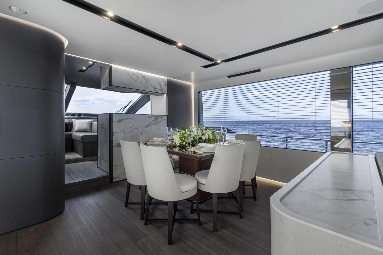 a room with a table and chairs aboard SO SO NICE Yacht for Sale