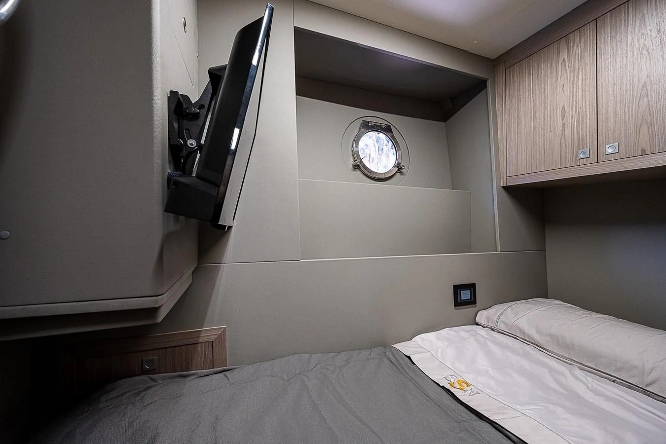 a room with a bed and a desk aboard SO SO NICE Yacht for Sale