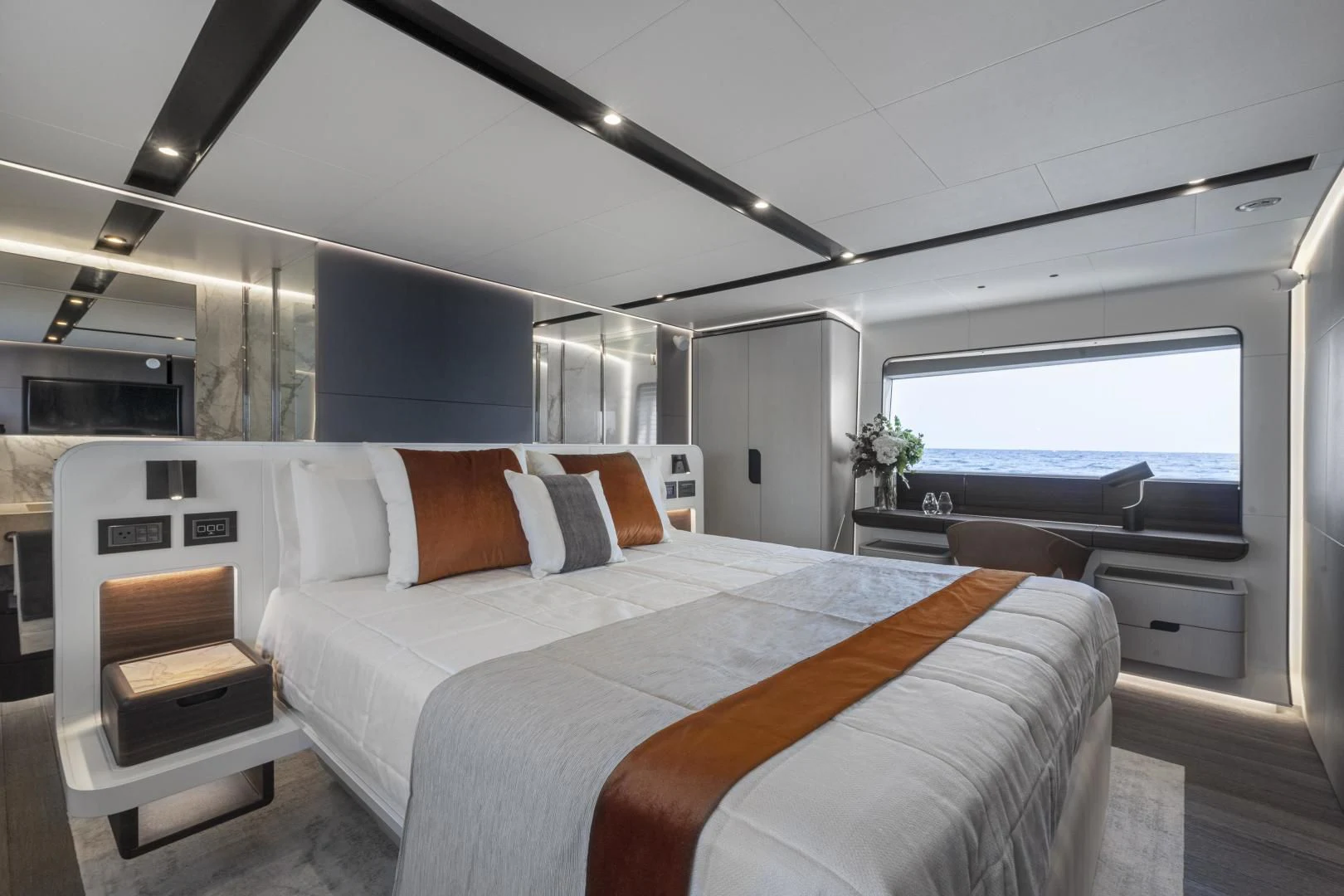 a room with a bed and a chair aboard SO SO NICE Yacht for Sale