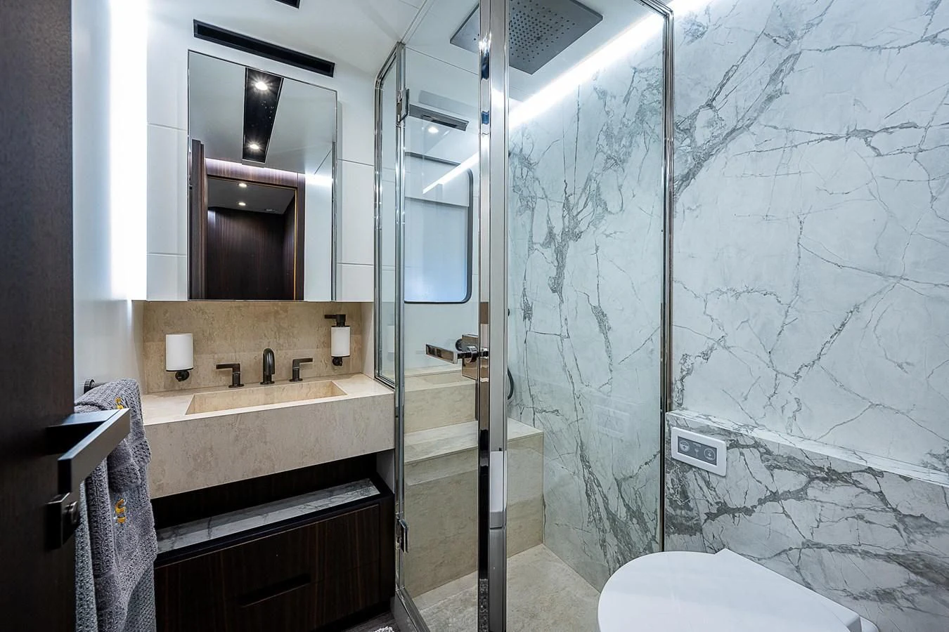 a bathroom with a glass shower aboard SO SO NICE Yacht for Sale