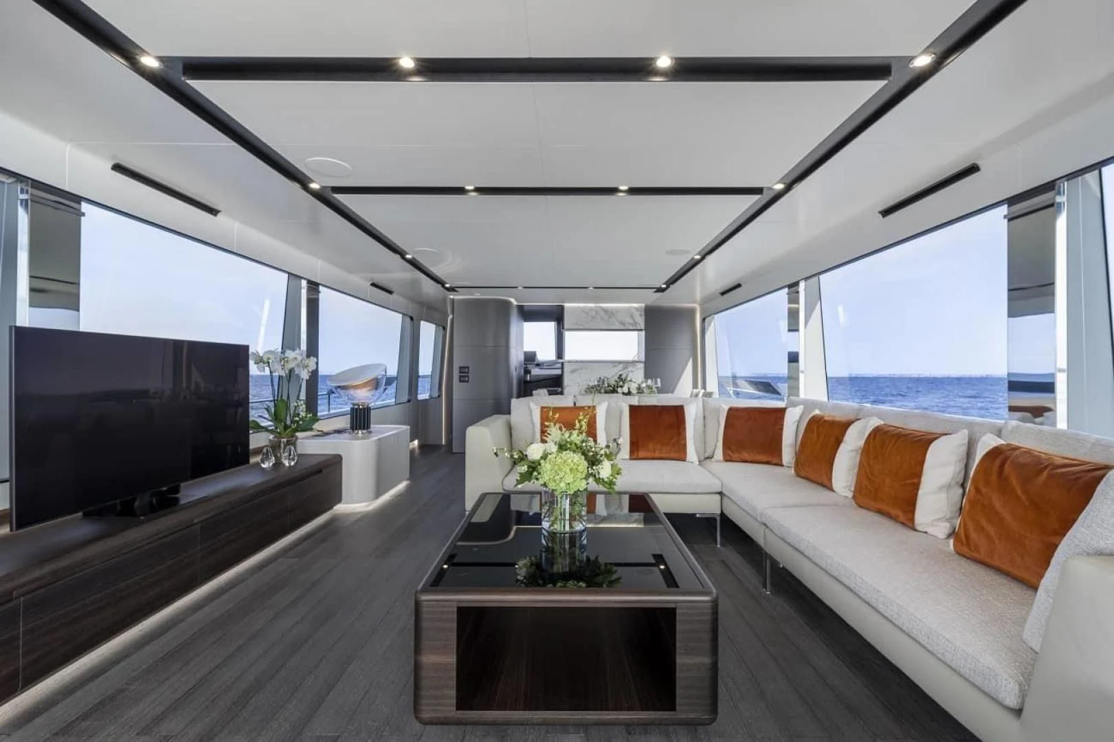 a living room with a large window aboard SO SO NICE Yacht for Sale