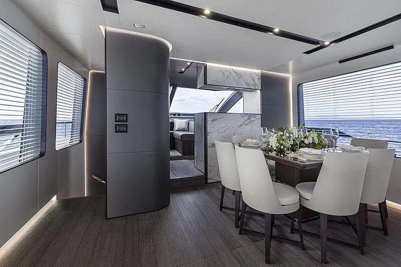 a room with a table and chairs aboard SO SO NICE Yacht for Sale