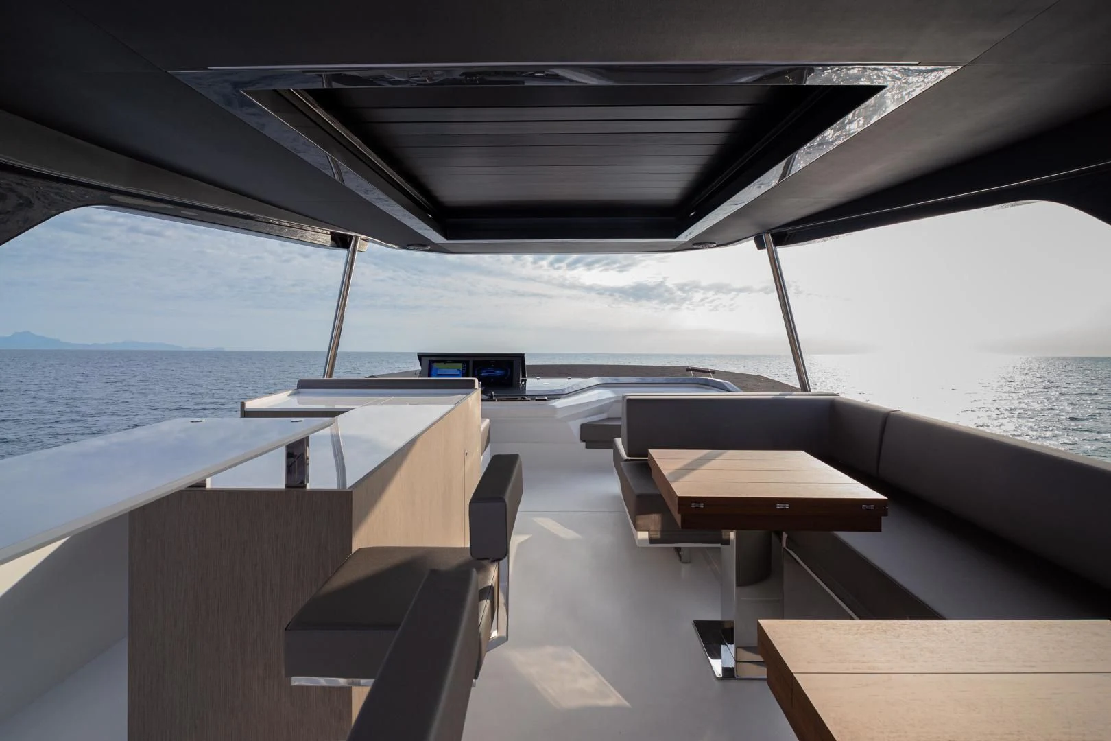 a deck with a view of the ocean and the ocean aboard SO SO NICE Yacht for Sale