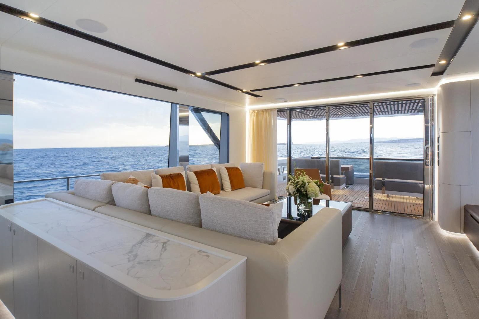 a living room with a large window aboard SO SO NICE Yacht for Sale