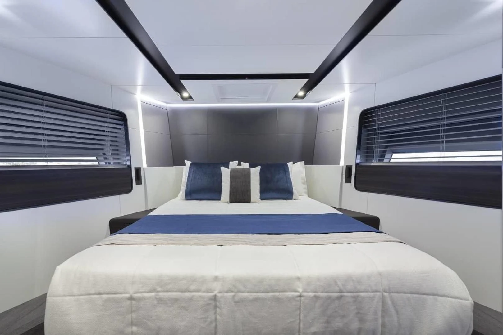 a bed in a room aboard SO SO NICE Yacht for Sale