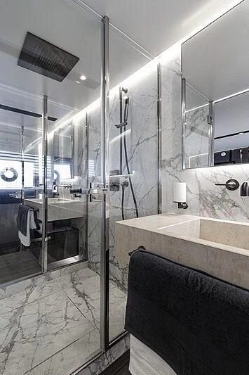 a bathroom with a glass shower aboard SO SO NICE Yacht for Sale