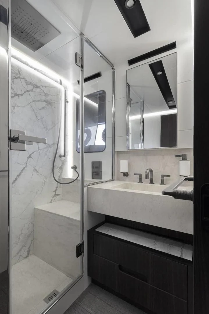 a bathroom with a sink and mirror aboard SO SO NICE Yacht for Sale