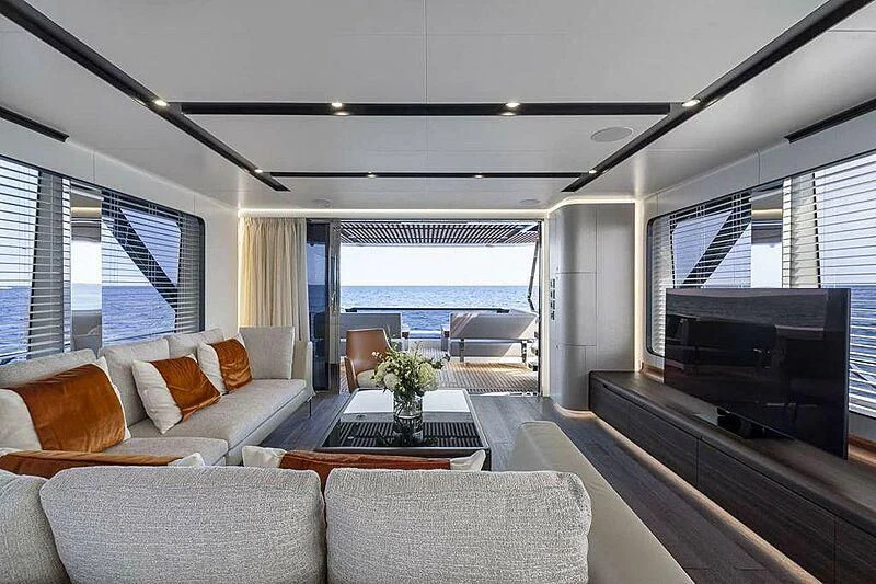 a living room with a large window aboard SO SO NICE Yacht for Sale