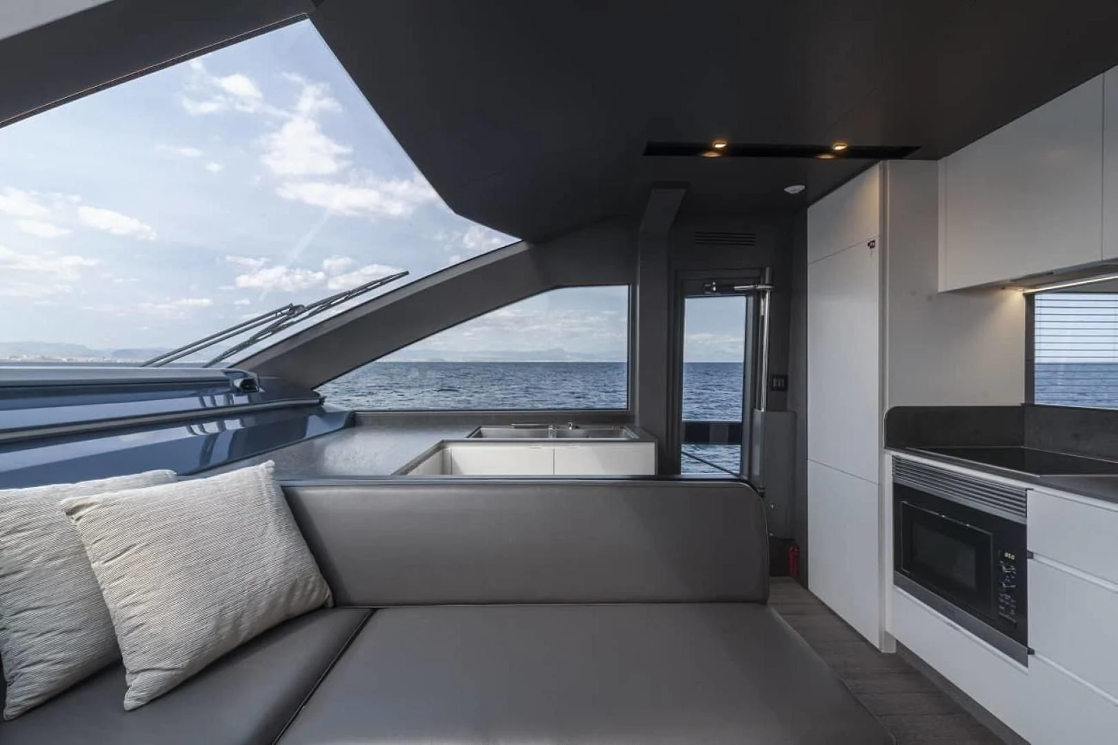 a white couch in a room aboard SO SO NICE Yacht for Sale