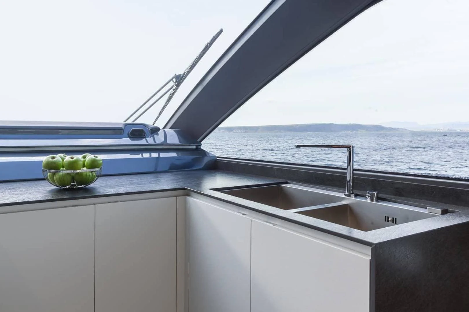 a kitchen with a sink and a window aboard SO SO NICE Yacht for Sale