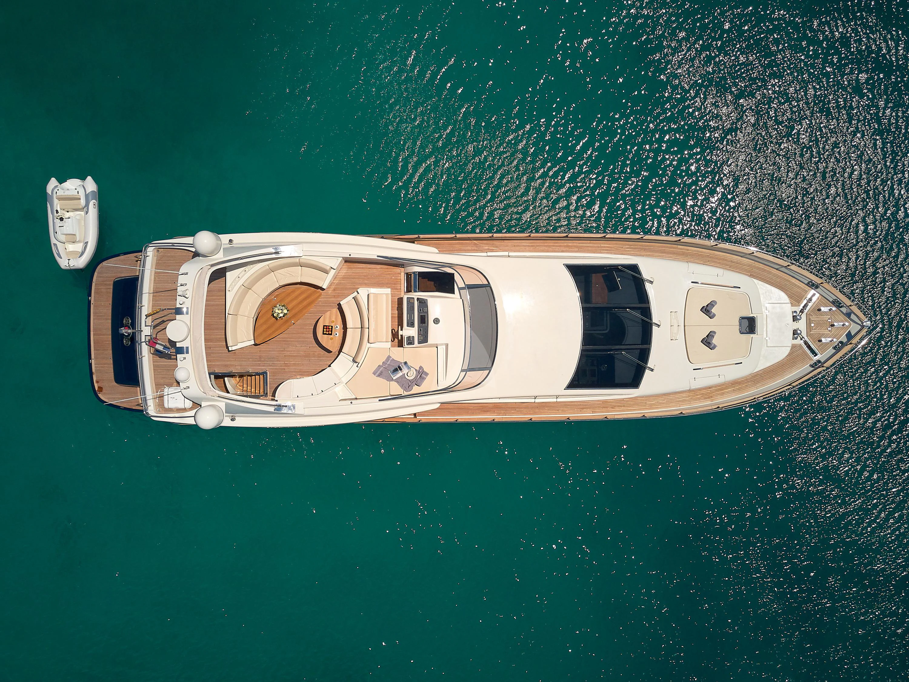 a white and black boat on water aboard 888 Yacht for Sale