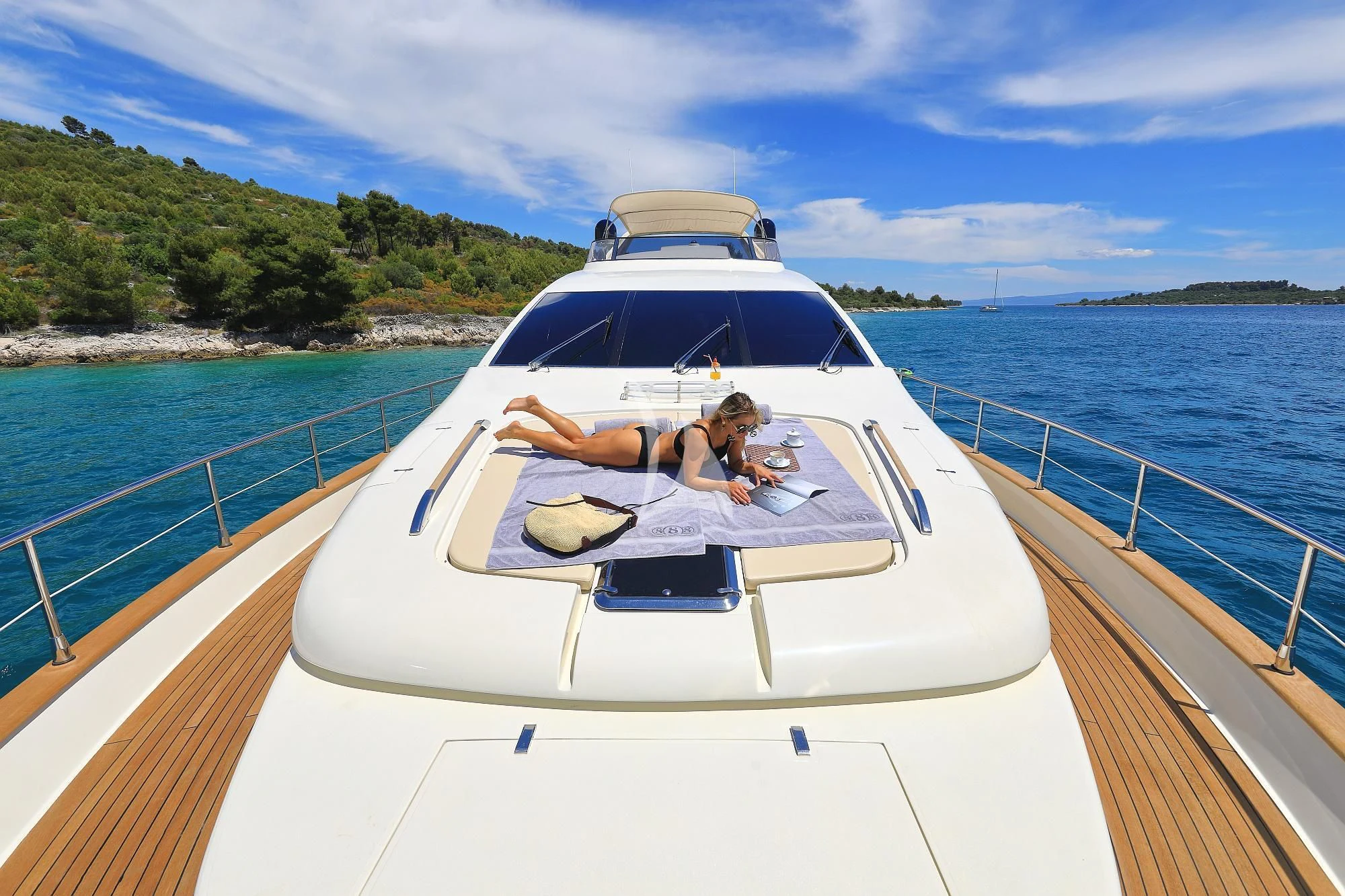 a person sitting in a white boat aboard 888 Yacht for Sale
