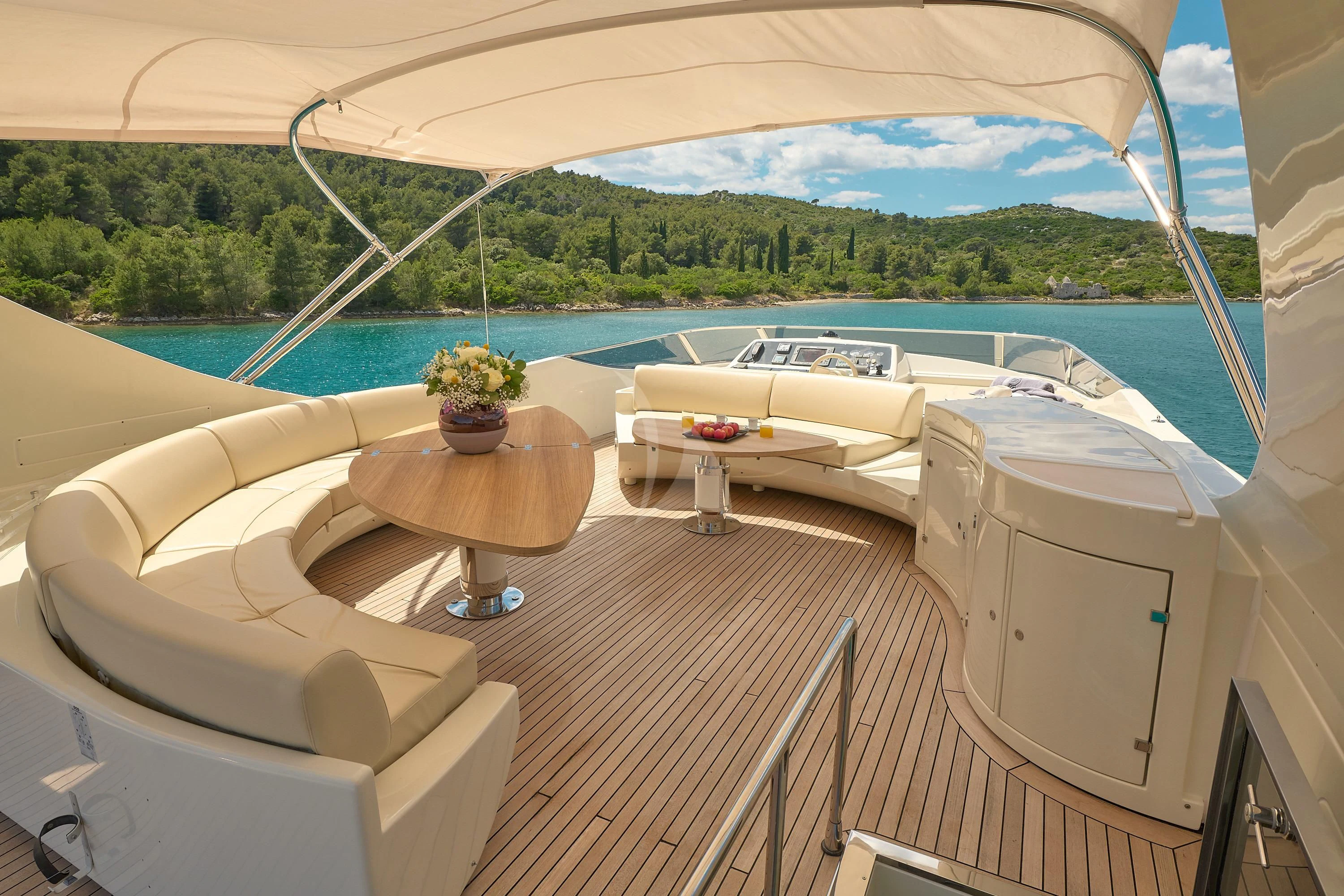 a room with a table chairs and a pool aboard 888 Yacht for Sale