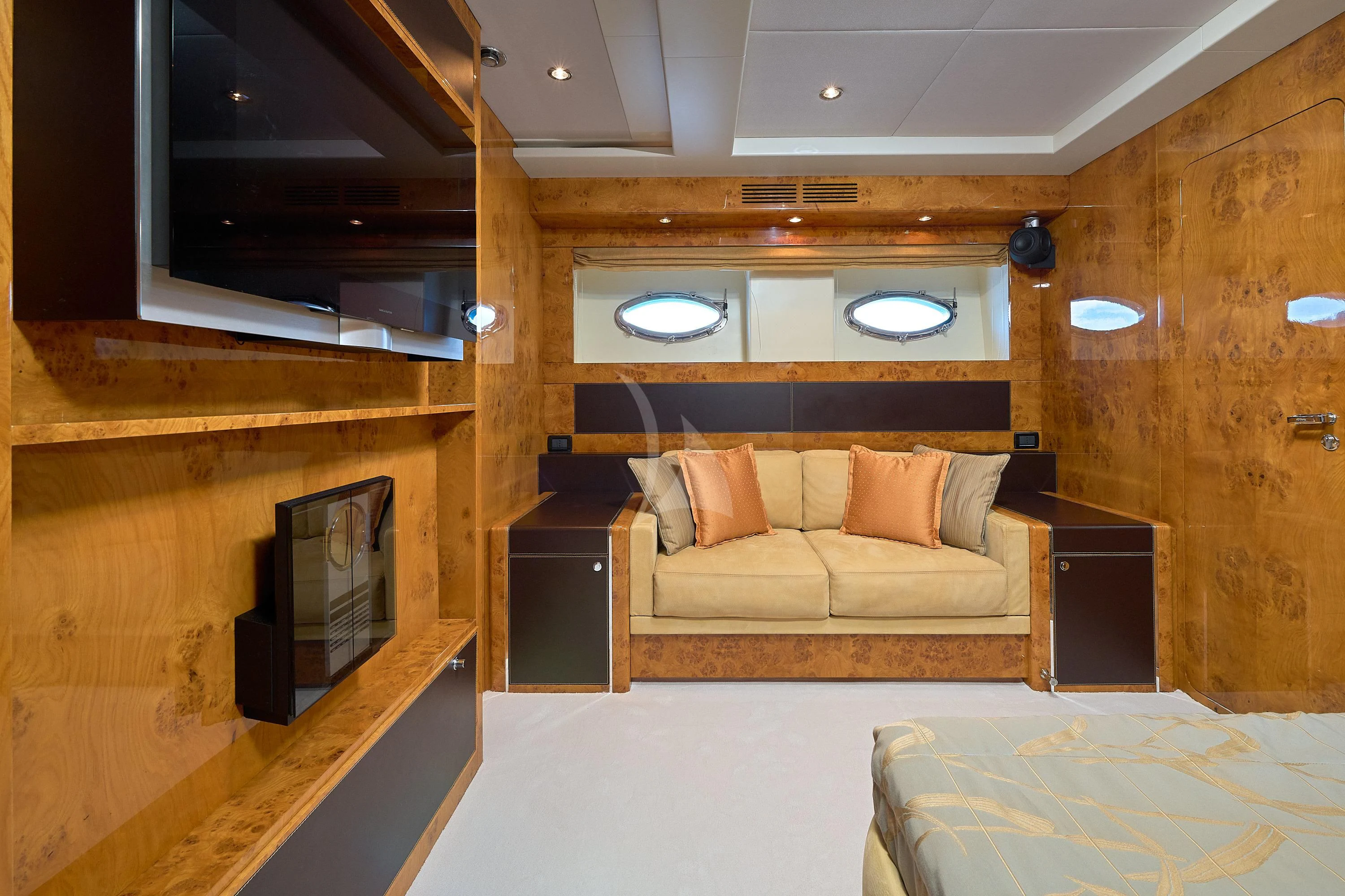 a room with a couch and a television aboard 888 Yacht for Sale