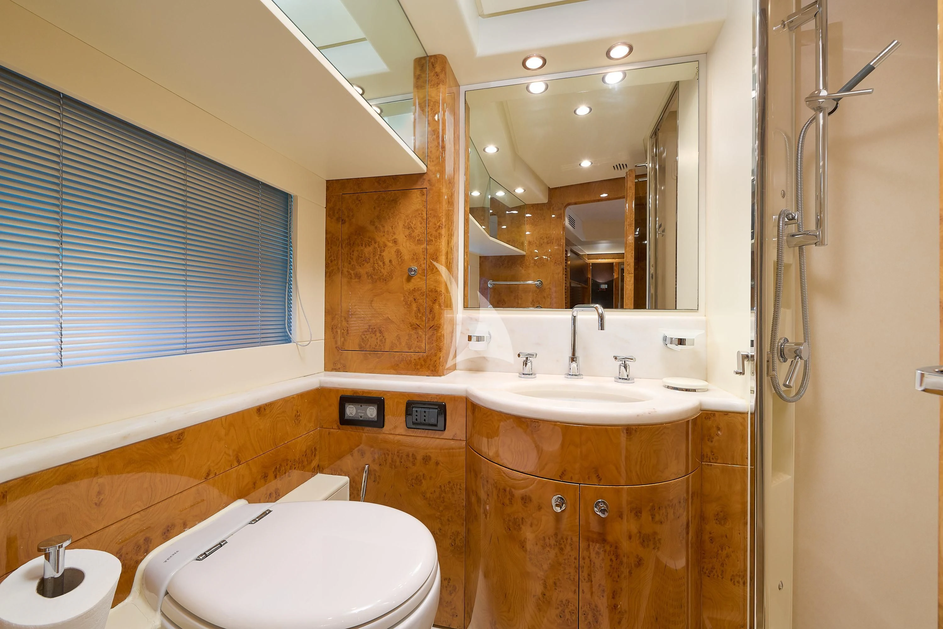 a bathroom with a toilet and a sink aboard 888 Yacht for Sale