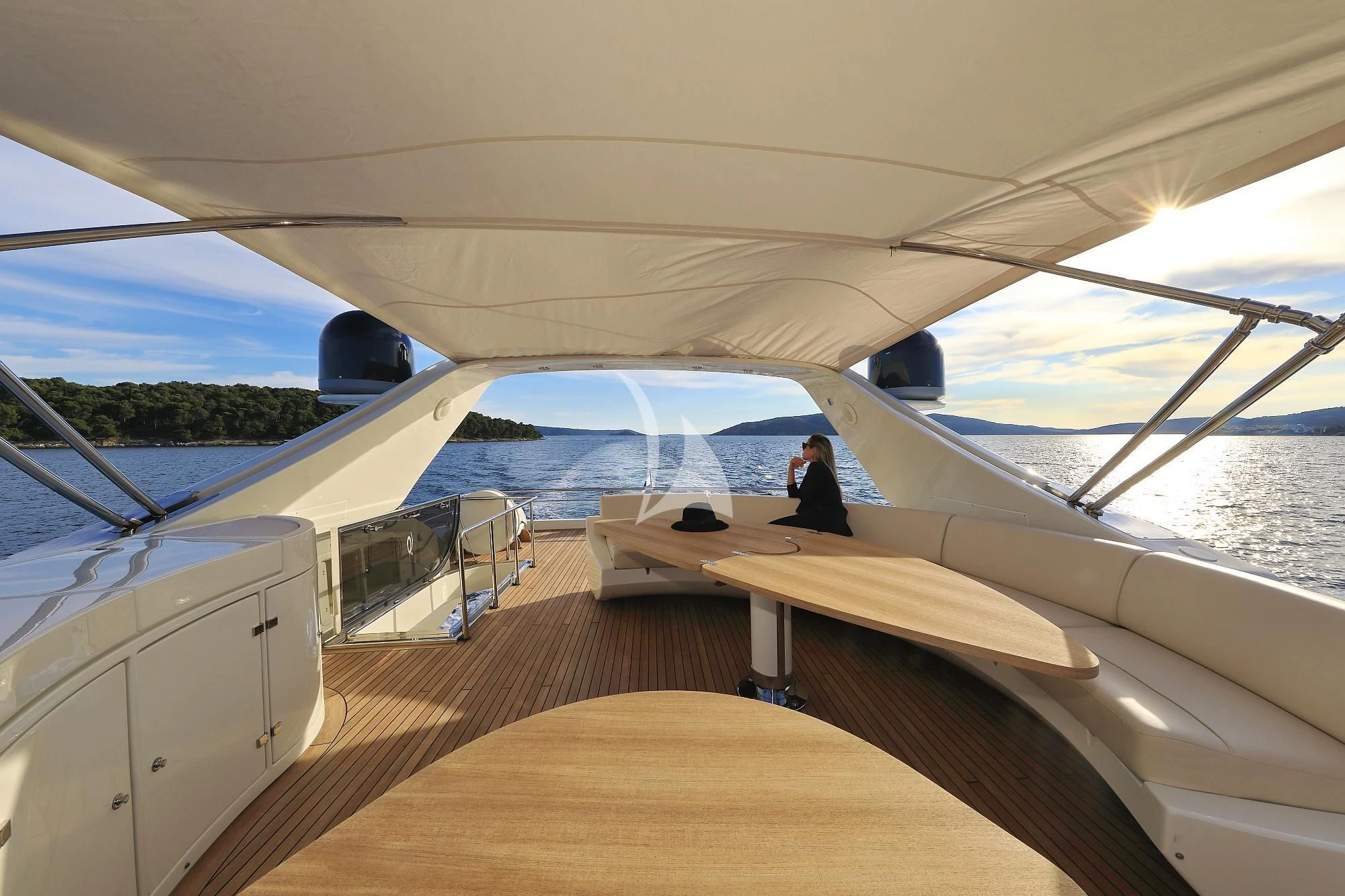 a person sitting on a boat aboard 888 Yacht for Sale