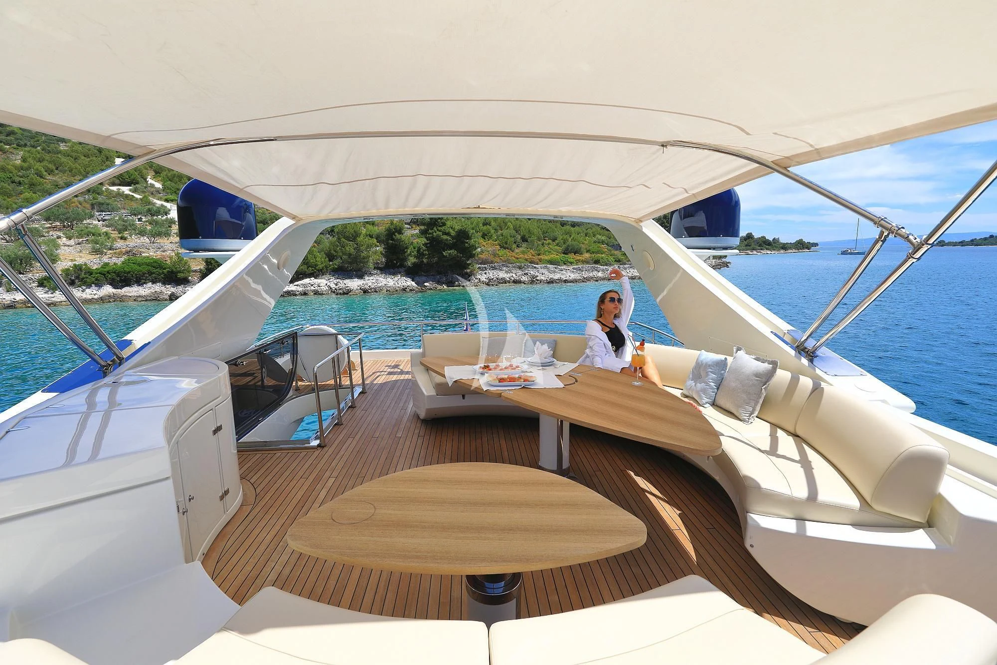 a person sitting on a boat aboard 888 Yacht for Sale