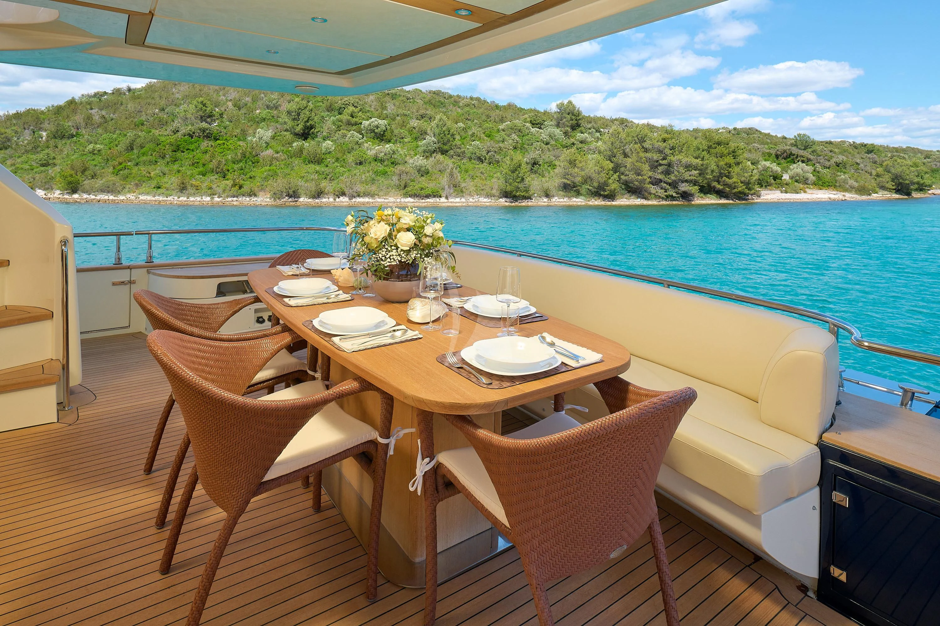 a table set for a meal on a boat aboard 888 Yacht for Sale